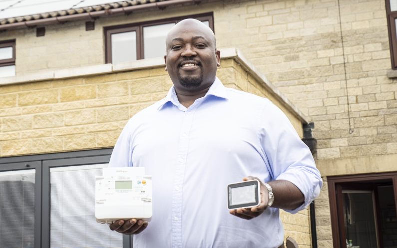 Customer holding smart meter